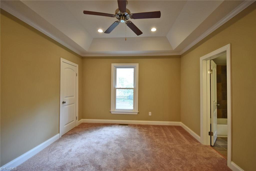7830 Broad Street Rural Hall, NC 27045 - Photo 11 of 25 The master bedroom features this trey ceiling complete with recessed lighting. Notice the arched panel doors.