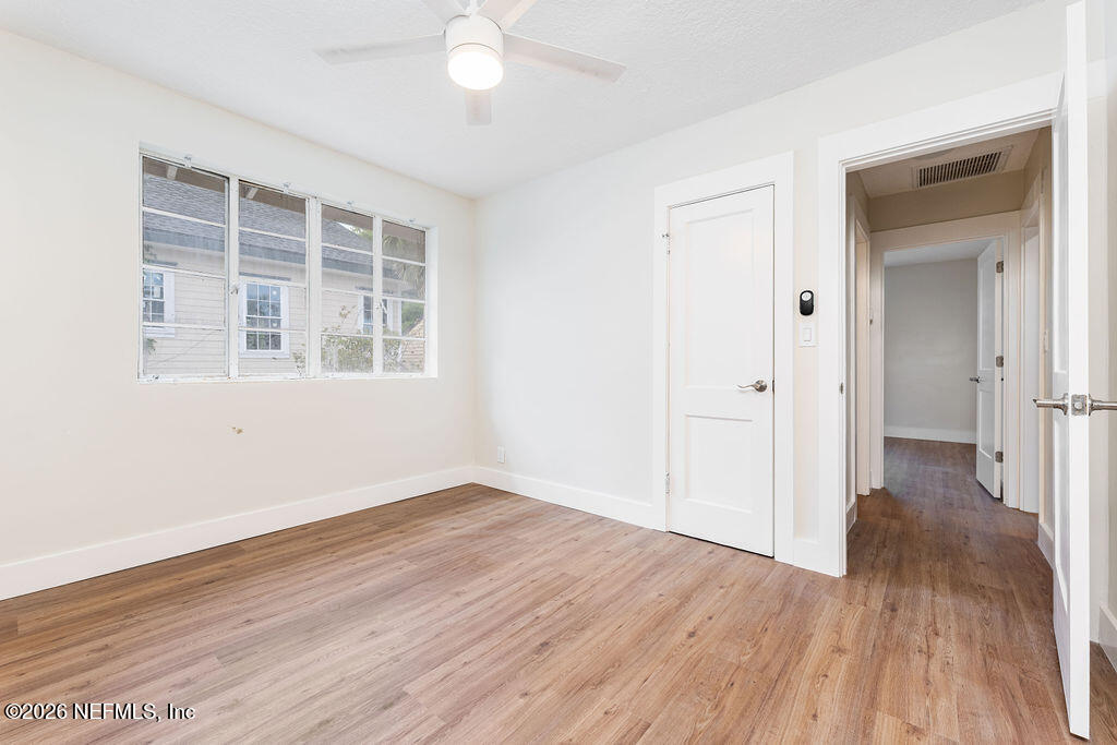 2247 Riverside Avenue, Unit 6 Jacksonville, FL 32204 - Photo 8 of 16 wooden floor in an empty room with a window
