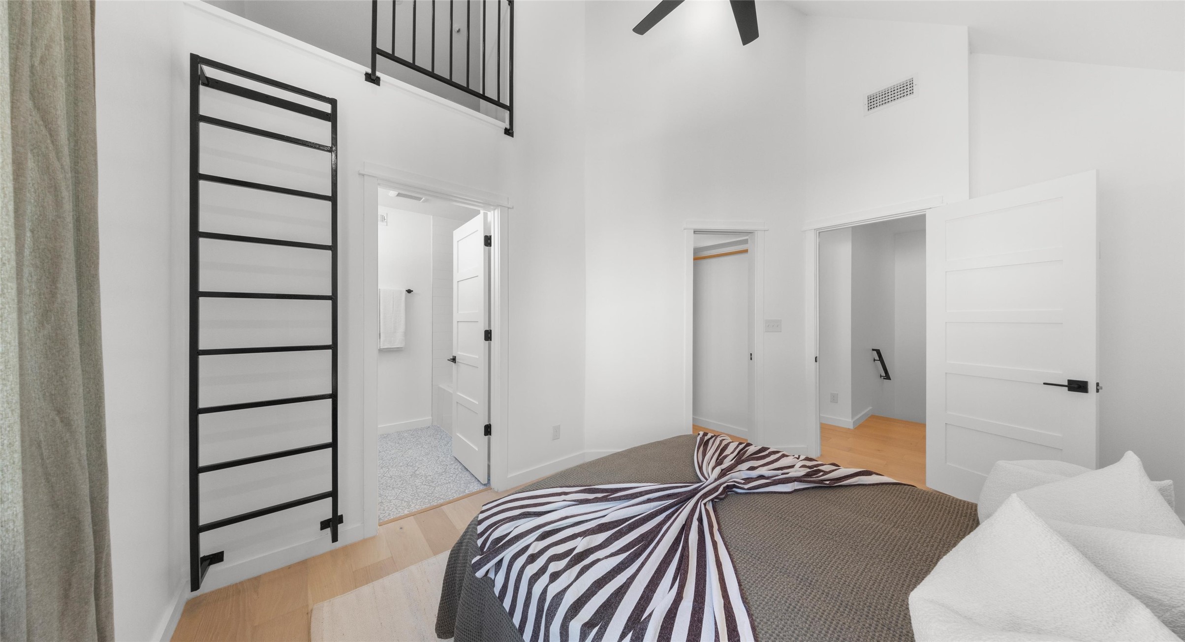 5912 Harold Court, Unit 107 Austin, TX 78721 - Photo 28 of 35 A versatile bedroom with its own ensuite access, offering privacy and flexibility for guests or work-from-home days. Model No. 105 Shown.