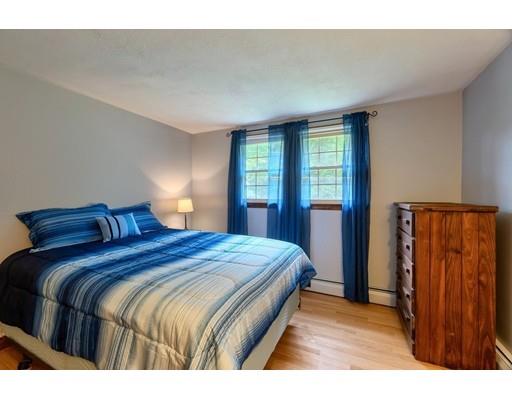 21 Bemis Road Pepperell, MA 01463 - Photo 13 of 27 a bedroom with a bed and a window