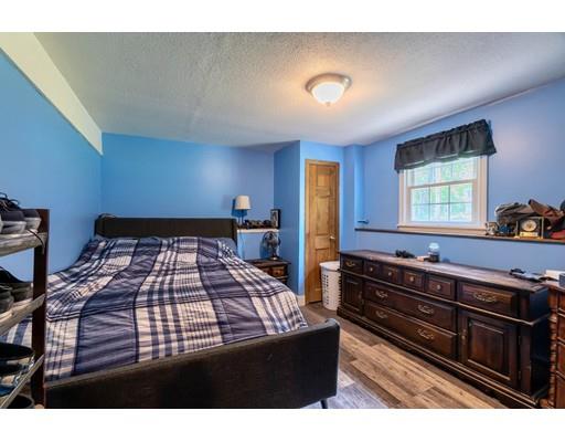 21 Bemis Road Pepperell, MA 01463 - Photo 19 of 27 a bedroom with a bed and window