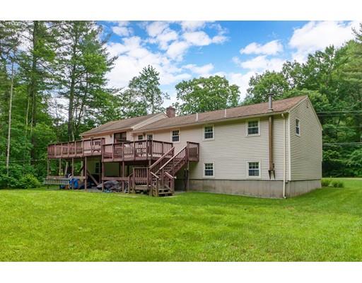 21 Bemis Road Pepperell, MA 01463 - Photo 25 of 27 a view of a house with a yard and sitting area