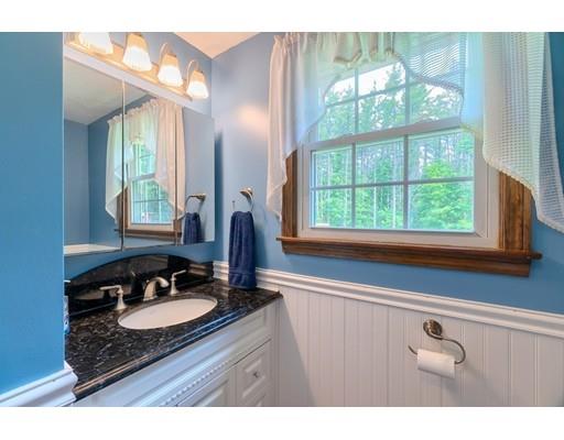 21 Bemis Road Pepperell, MA 01463 - Photo 9 of 27 a bathroom with a granite countertop sink a window and a mirror