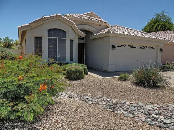 a view of a house with a small yard