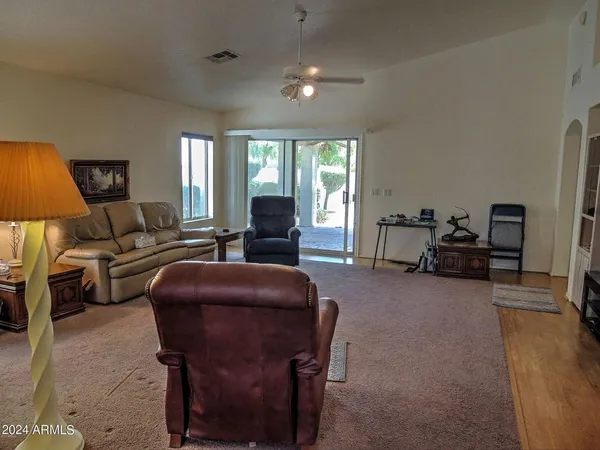 a living room with furniture and a large window