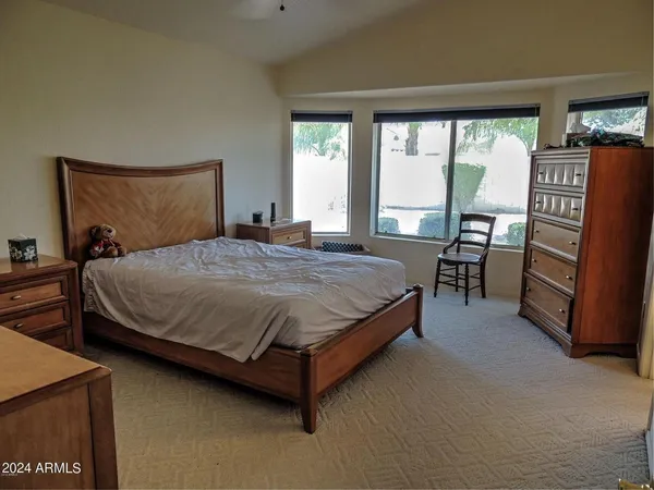 a bedroom with a bed and furniture