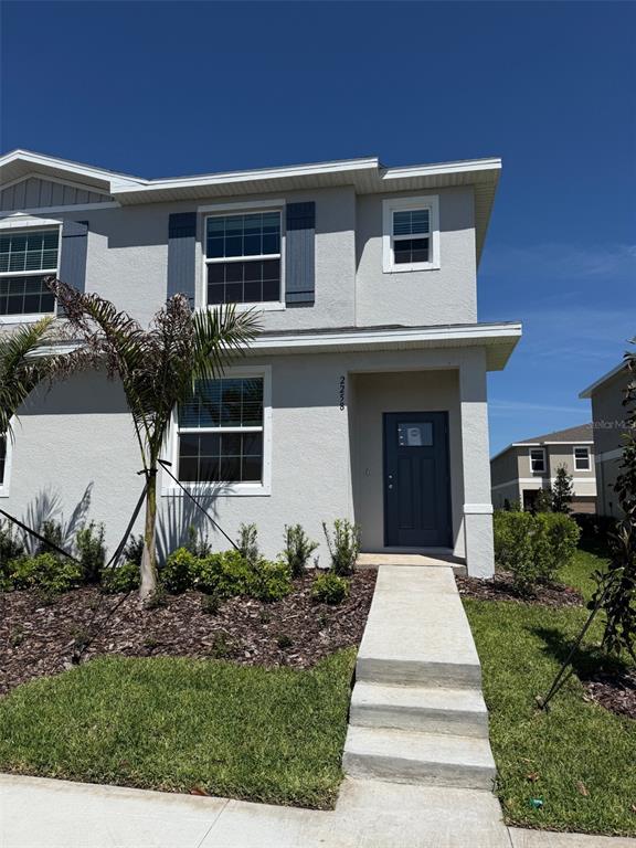 2258 Lesser Goldfinch Drive Wimauma, FL 33598 - Photo 1 of 1 a front view of a house with a yard