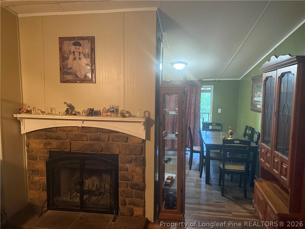 15041 Smith Road Gibson, NC 28343 - Photo 5 of 20 fire place and view of dining area