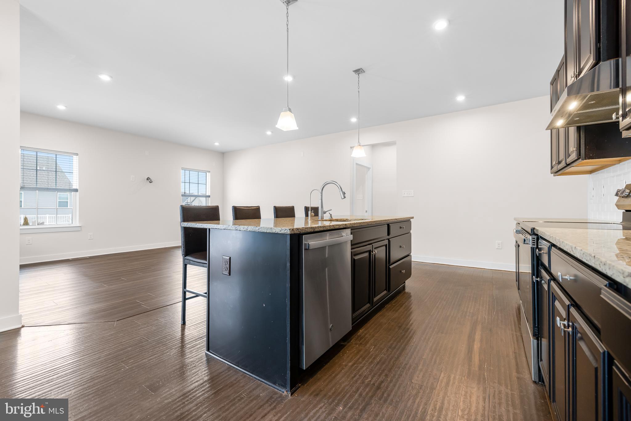 929 Robinson Road Townsend, DE 19734 - Photo 12 of 57 a kitchen with stainless steel appliances granite countertop a stove and a sink
