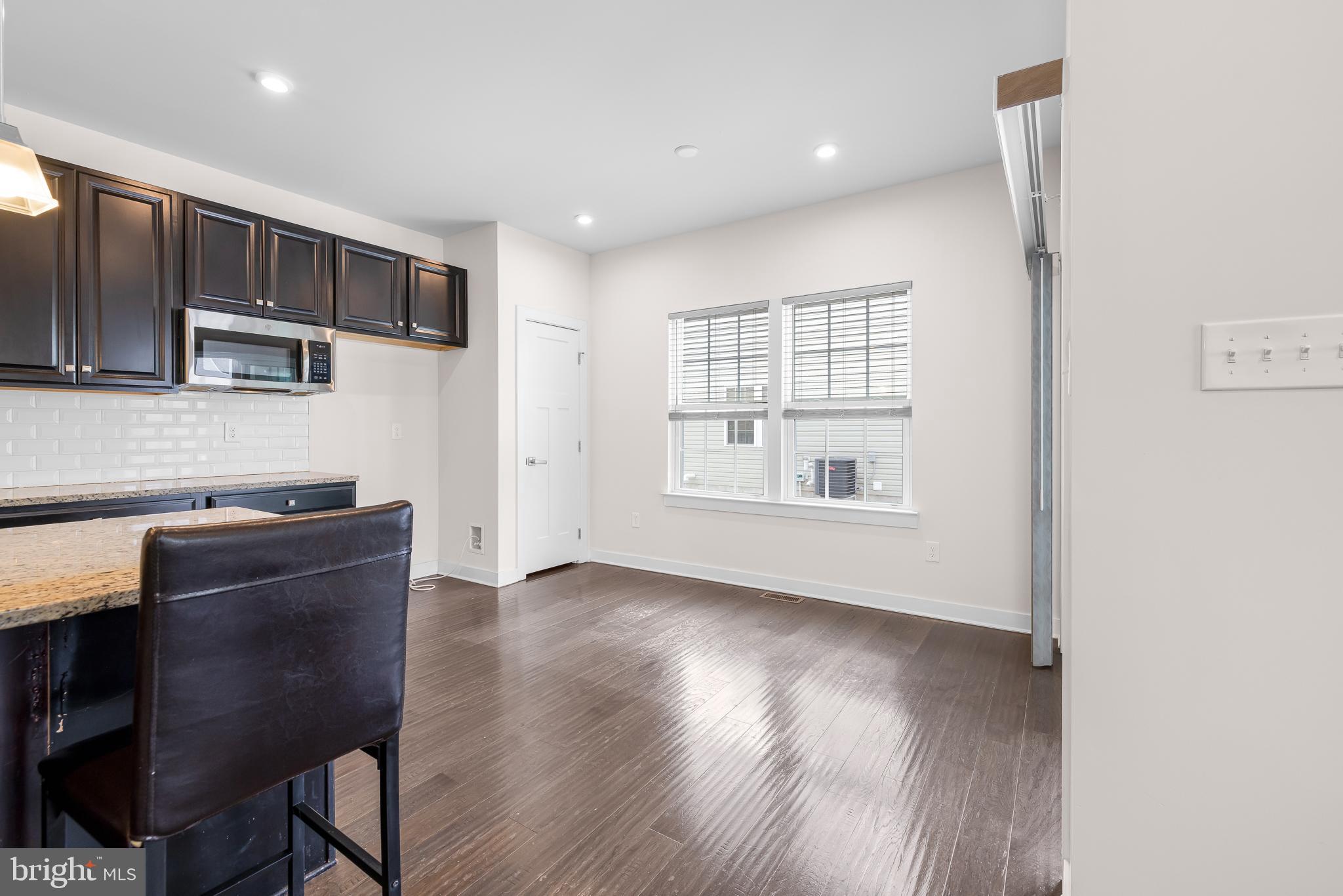 929 Robinson Road Townsend, DE 19734 - Photo 14 of 57 a kitchen with stainless steel appliances granite countertop a stove a sink and a microwave