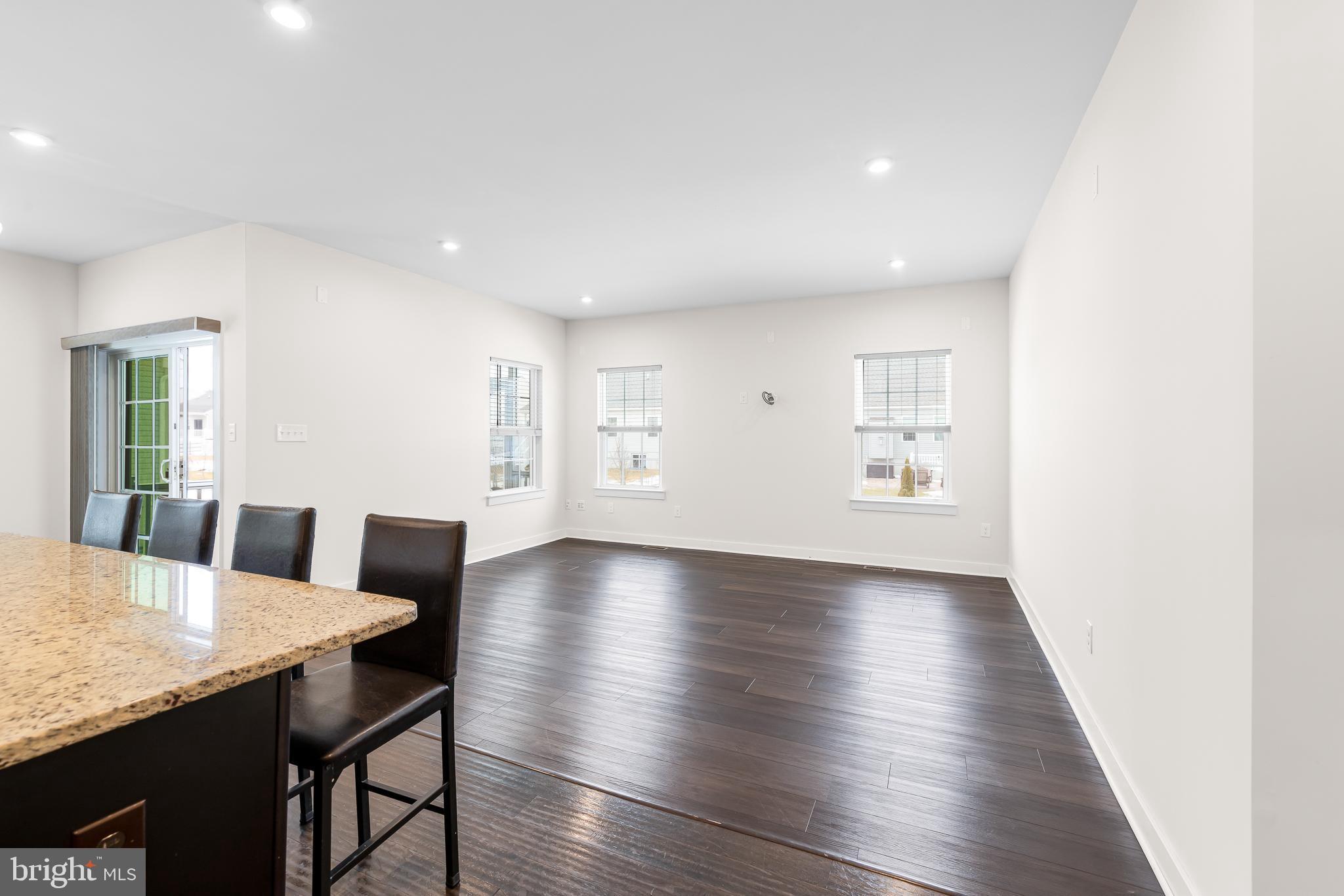 929 Robinson Road Townsend, DE 19734 - Photo 16 of 57 a view of a dining room with furniture and wooden floor