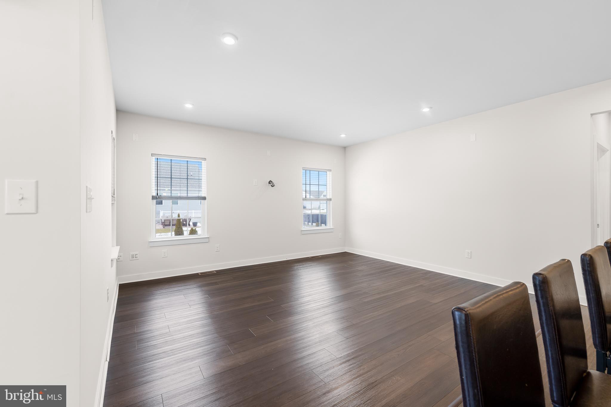 929 Robinson Road Townsend, DE 19734 - Photo 17 of 57 a view of an empty room with wooden floor and a window