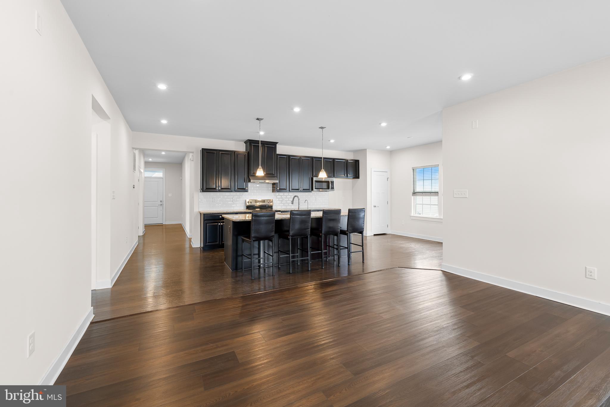 929 Robinson Road Townsend, DE 19734 - Photo 18 of 57 a view of a kitchen with dining table and chairs