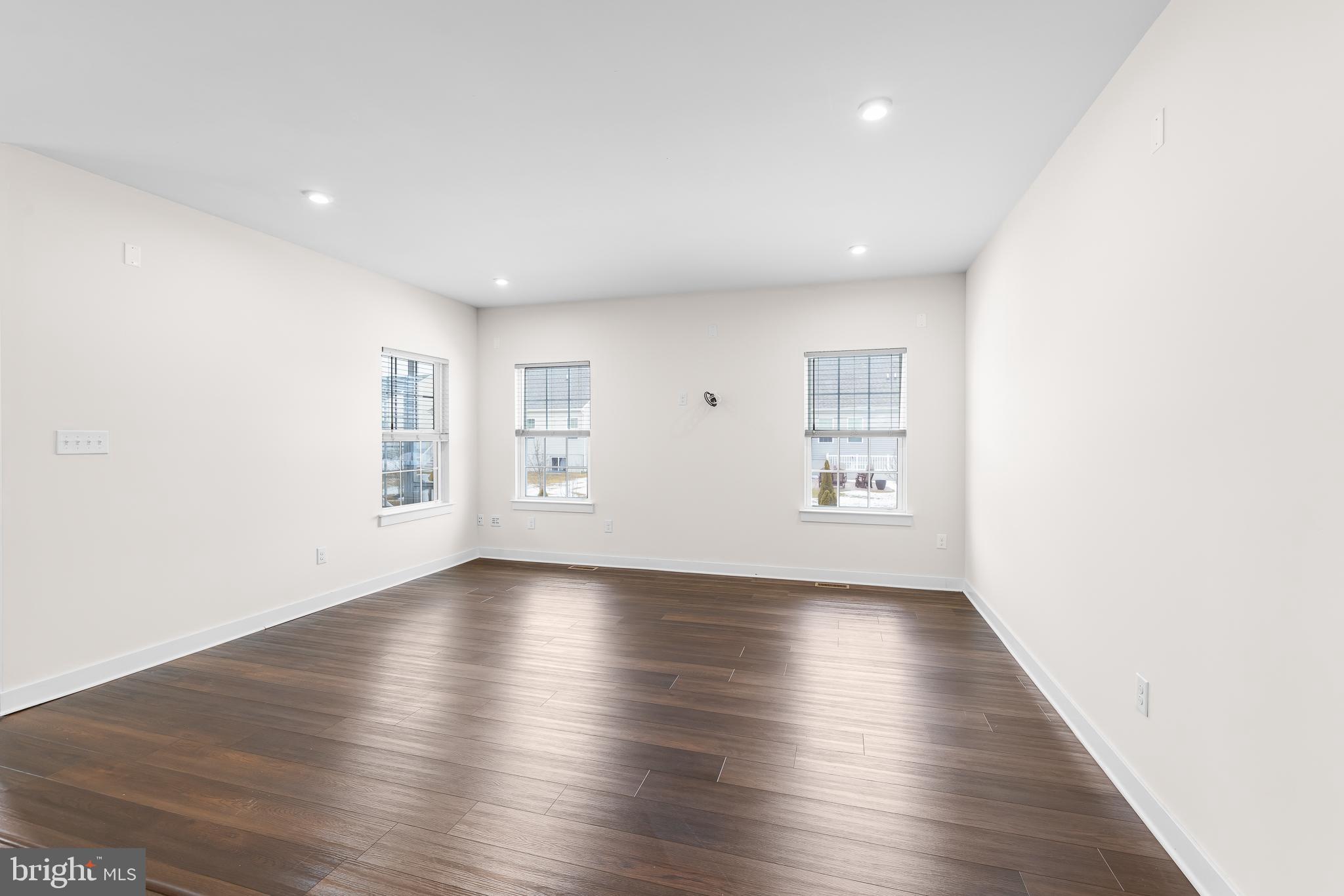 929 Robinson Road Townsend, DE 19734 - Photo 21 of 57 a view of an empty room with wooden floor and a window