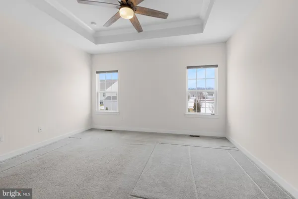 a bathroom with a double vanity sink toilet and mirror