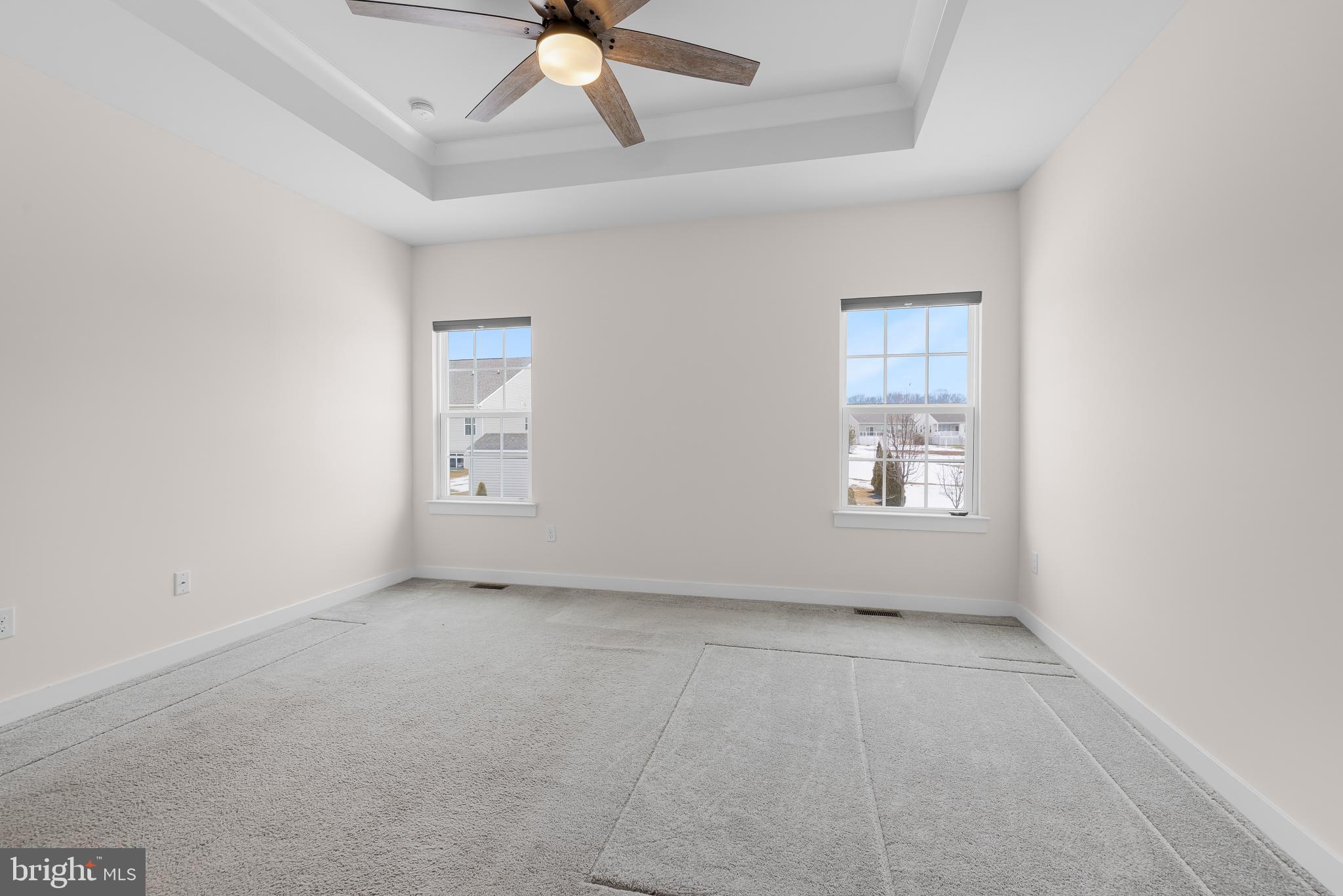 929 Robinson Road Townsend, DE 19734 - Photo 25 of 57 an empty room with windows and fan