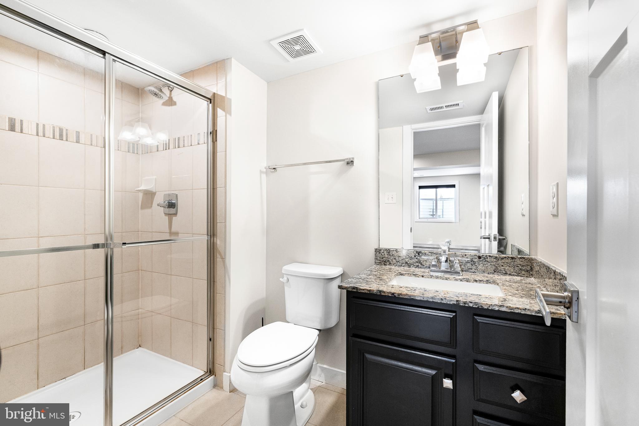 929 Robinson Road Townsend, DE 19734 - Photo 31 of 57 a bathroom with a sink toilet and shower