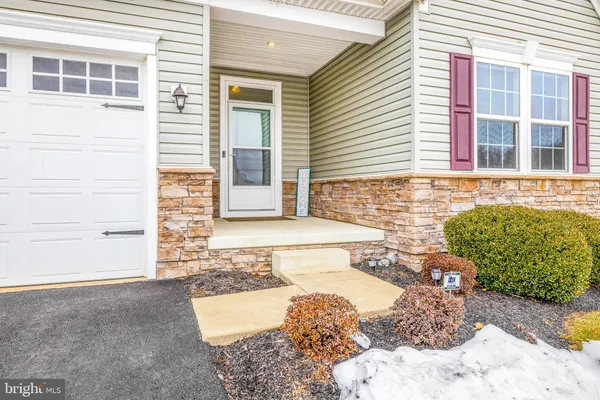 a view of hallway with wooden floor