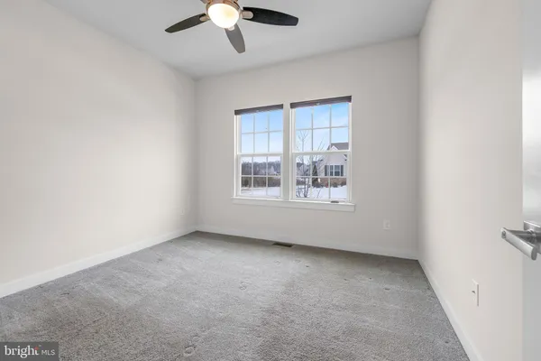 a bathroom with a granite countertop sink a toilet and bathtub