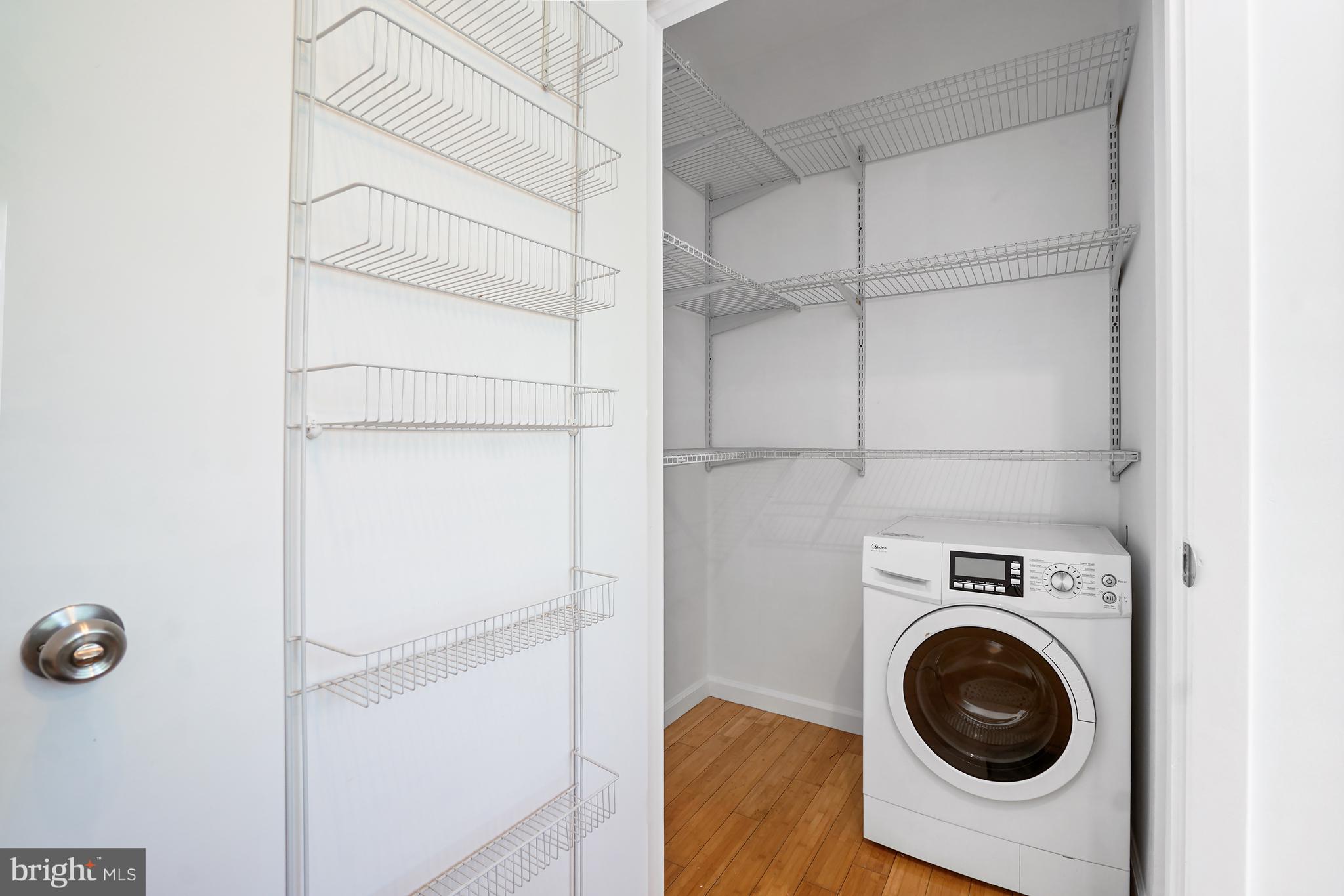 1822 15th Street Northwest, Unit 303 Washington, DC 20009 - Photo 18 of 22 a utility room with dryer and washer