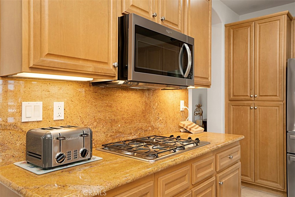 23858 Kaleb Drive Corona, CA 92883 - Photo 20 of 45 a stove top oven sitting inside of a kitchen
