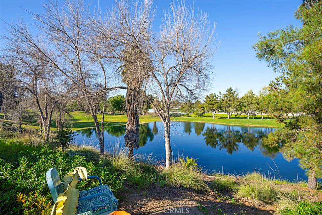 23858 Kaleb Drive Corona, CA 92883 - Photo 26 of 45 a view of a lake with a house in the background