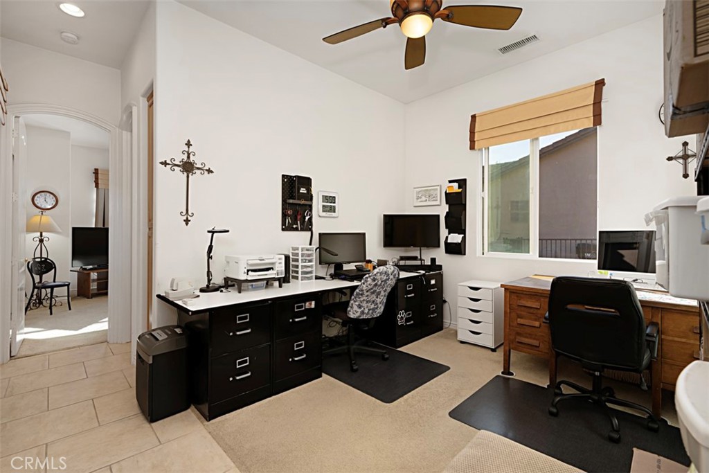 23858 Kaleb Drive Corona, CA 92883 - Photo 28 of 45 a view of a workspace with a window and gym equipment