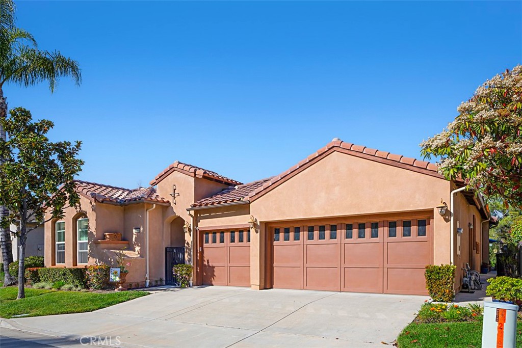 23858 Kaleb Drive Corona, CA 92883 - Photo 33 of 45 a front view of a house with a garage
