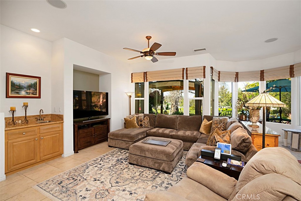 23858 Kaleb Drive Corona, CA 92883 - Photo 10 of 45 a living room with furniture and a flat screen tv