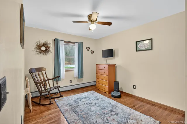 a view of a livingroom with furniture and a rug