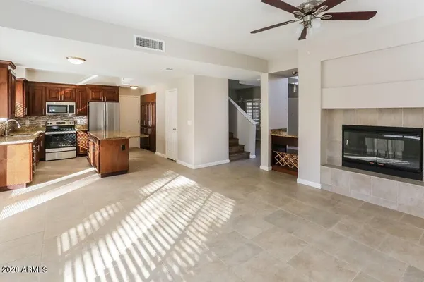 a bedroom with furniture and a fireplace
