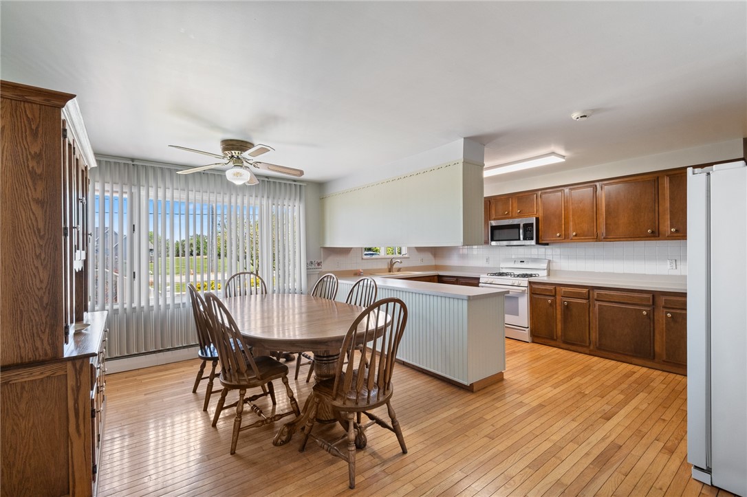 6075 Arbor Road Ontario, NY 14519 - Photo 8 of 27 Kitchen/Dining Area. Notice wood floors in GREAT s