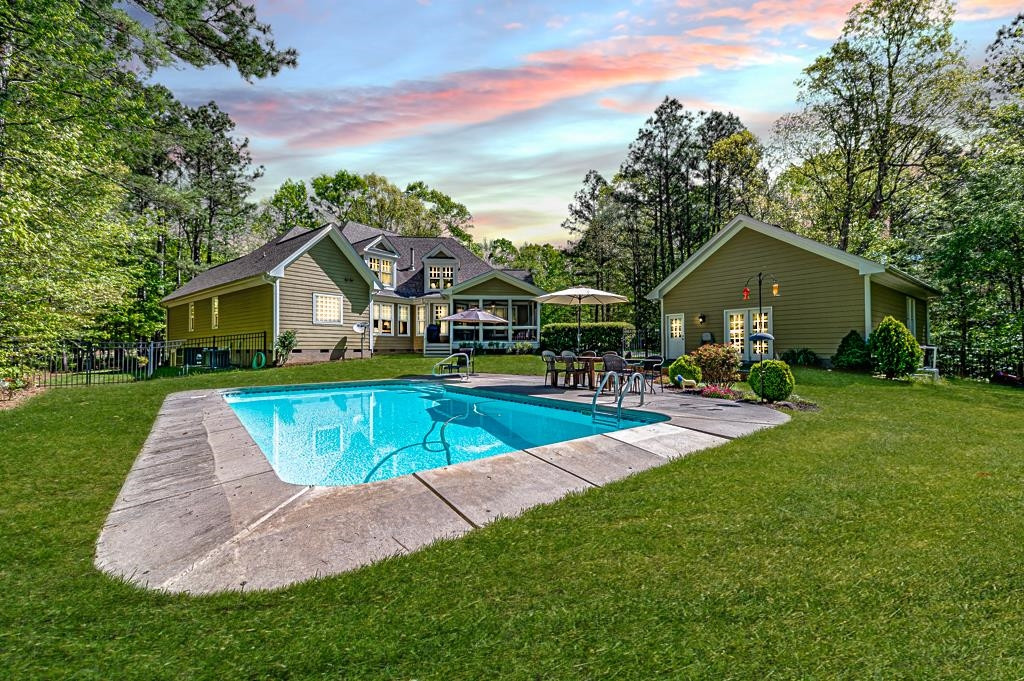 225 Henrys Ridge Road Pittsboro, NC 27312 - Photo 2 of 67 Large private backyard oasis with saltwater pool. View facing rear of home.