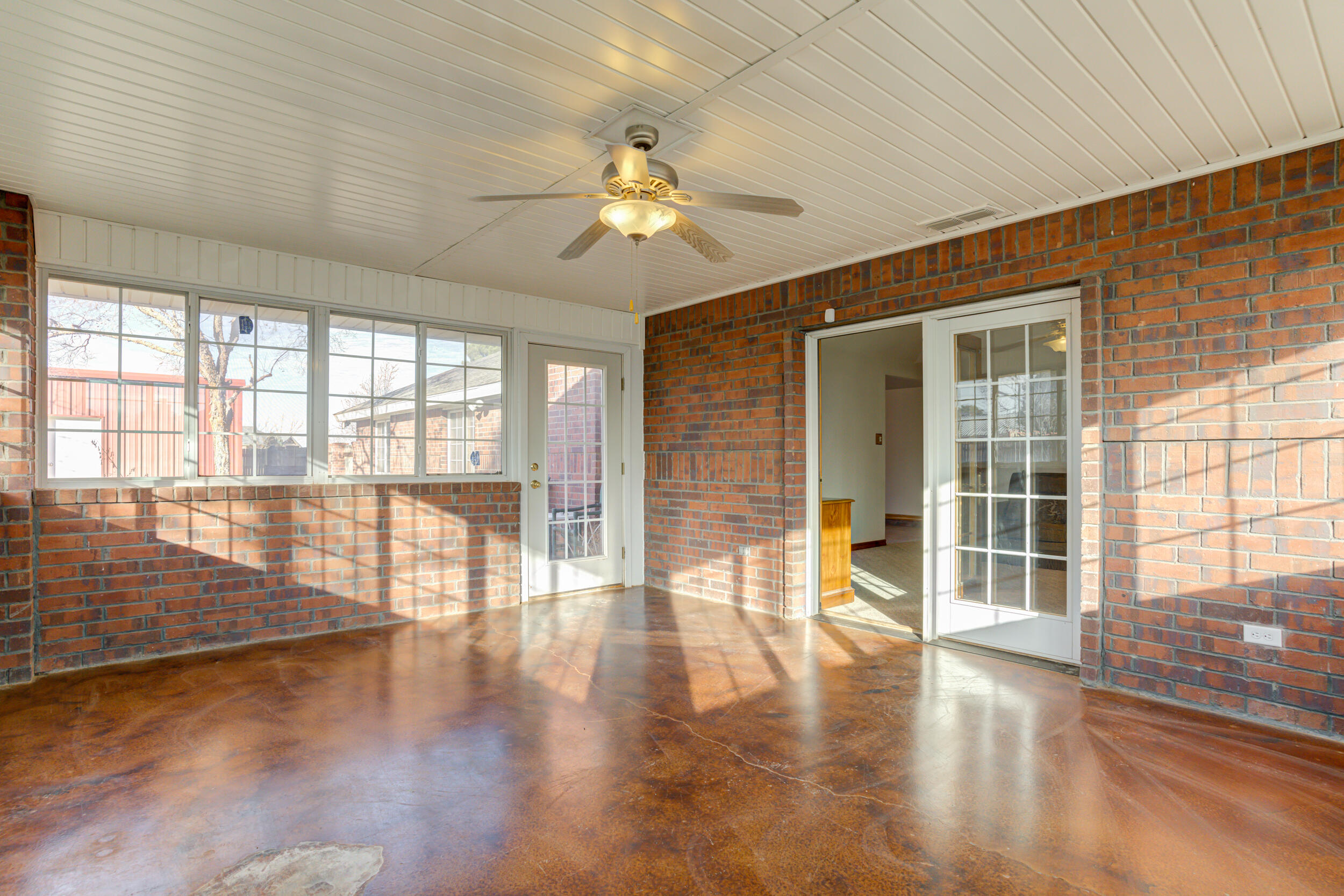 801 19th Street Seagraves, TX 79359 - Photo 11 of 24 wooden floor in an empty room with a window