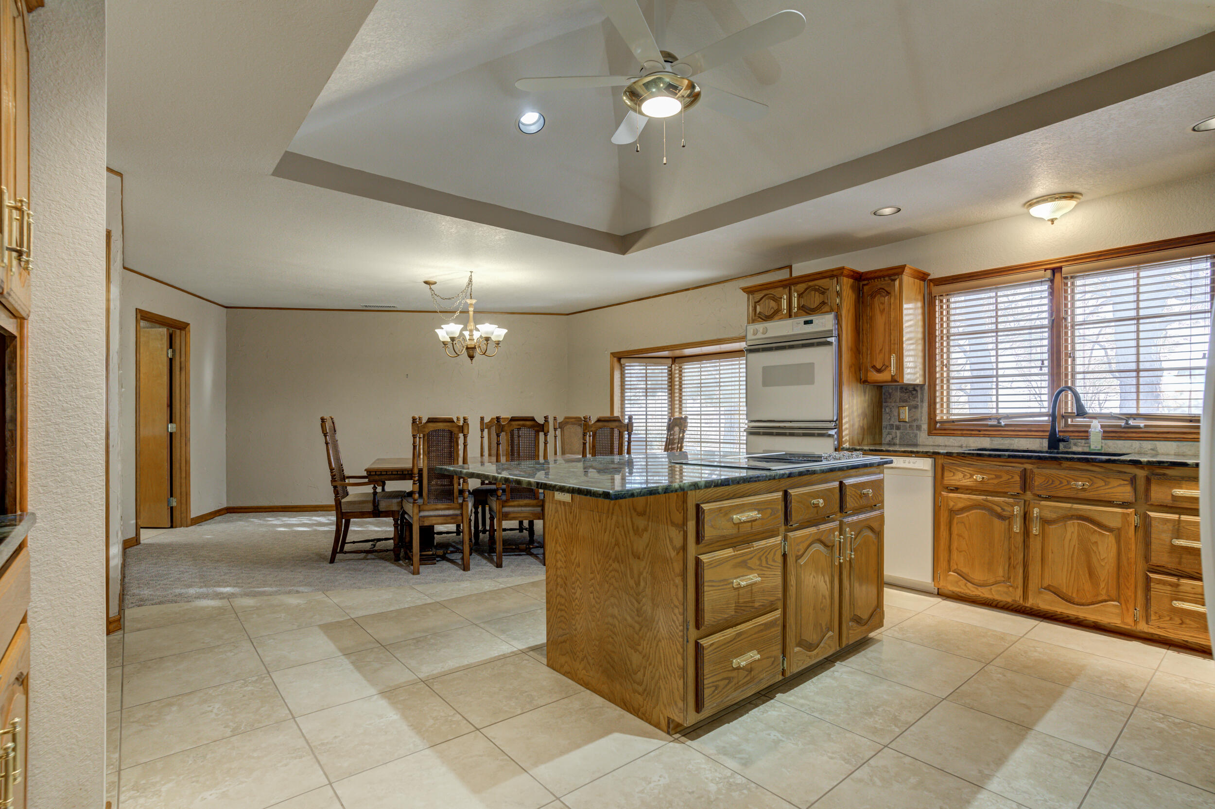 801 19th Street Seagraves, TX 79359 - Photo 15 of 24 a kitchen with stainless steel appliances granite countertop a sink and cabinets