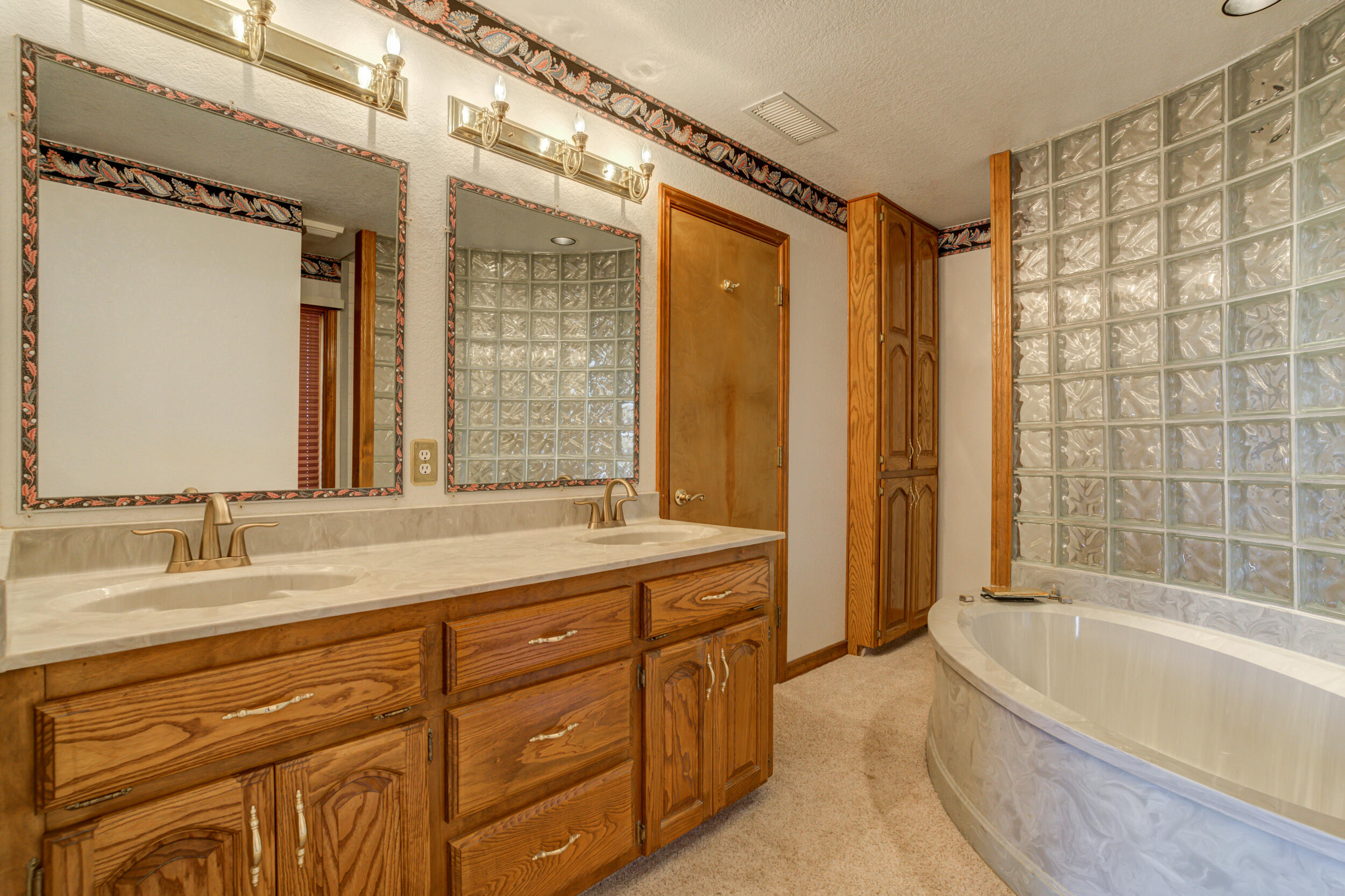801 19th Street Seagraves, TX 79359 - Photo 18 of 24 a bathroom with a granite countertop sink toilet tub and shower