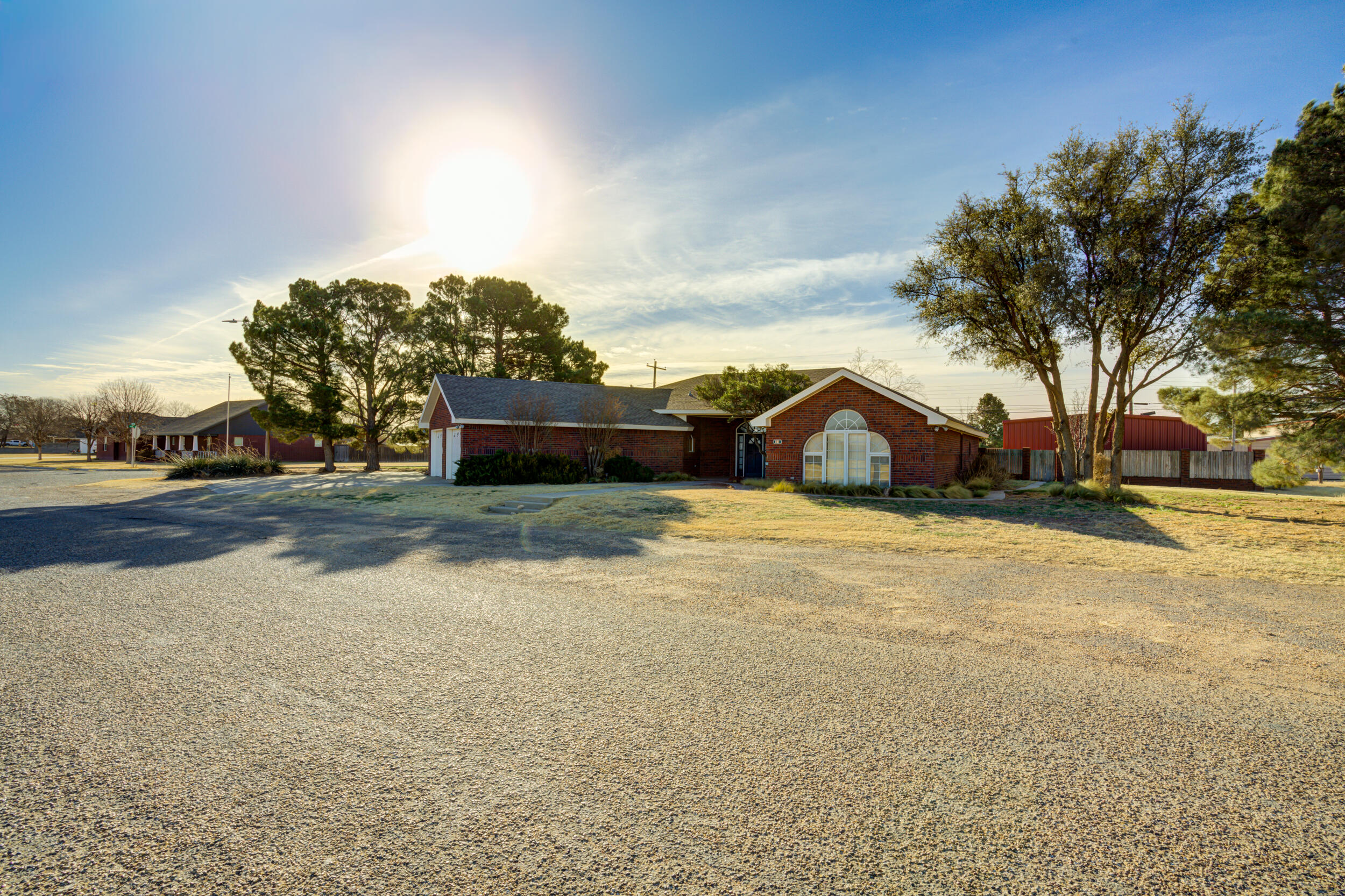 801 19th Street Seagraves, TX 79359 - Photo 2 of 24 a front view of a house with a yard and garage