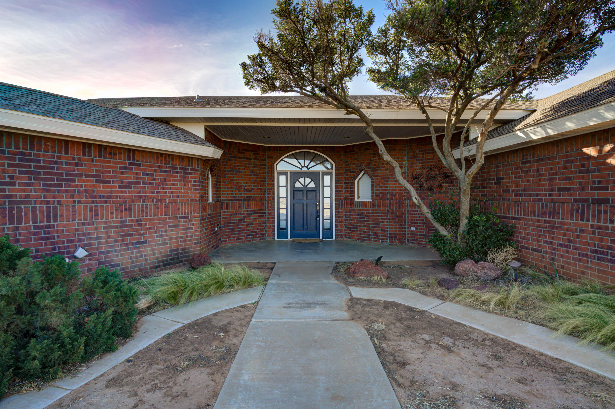 801 19th Street Seagraves, TX 79359 - Photo 3 of 24 a front view of a house with garden