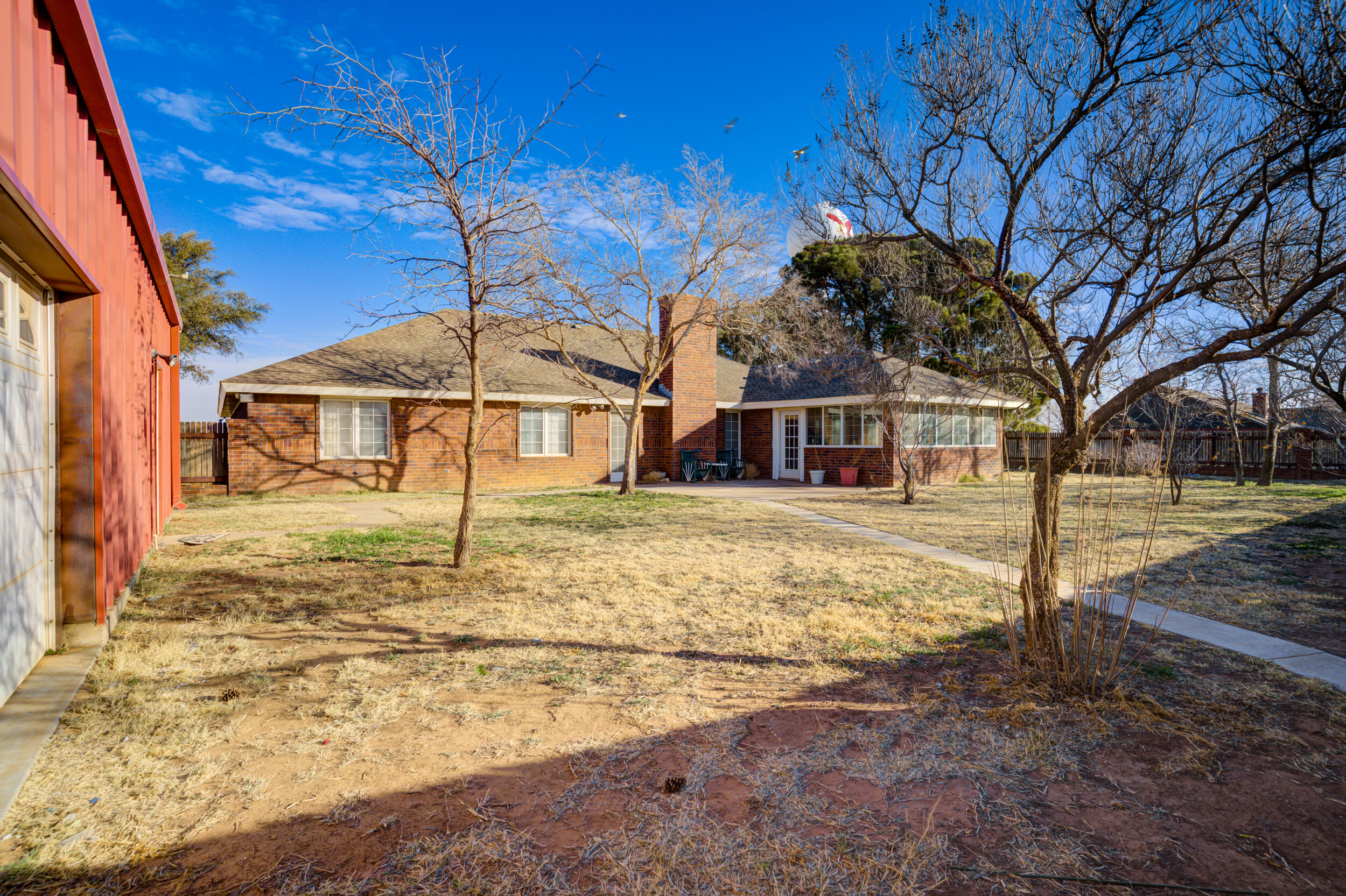 801 19th Street Seagraves, TX 79359 - Photo 5 of 24 a house with trees in front of it