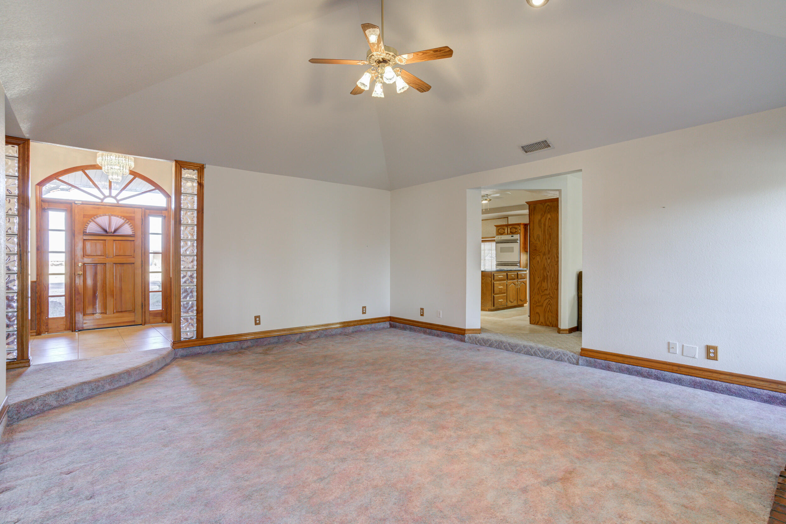 801 19th Street Seagraves, TX 79359 - Photo 8 of 24 a view of an empty room with a window