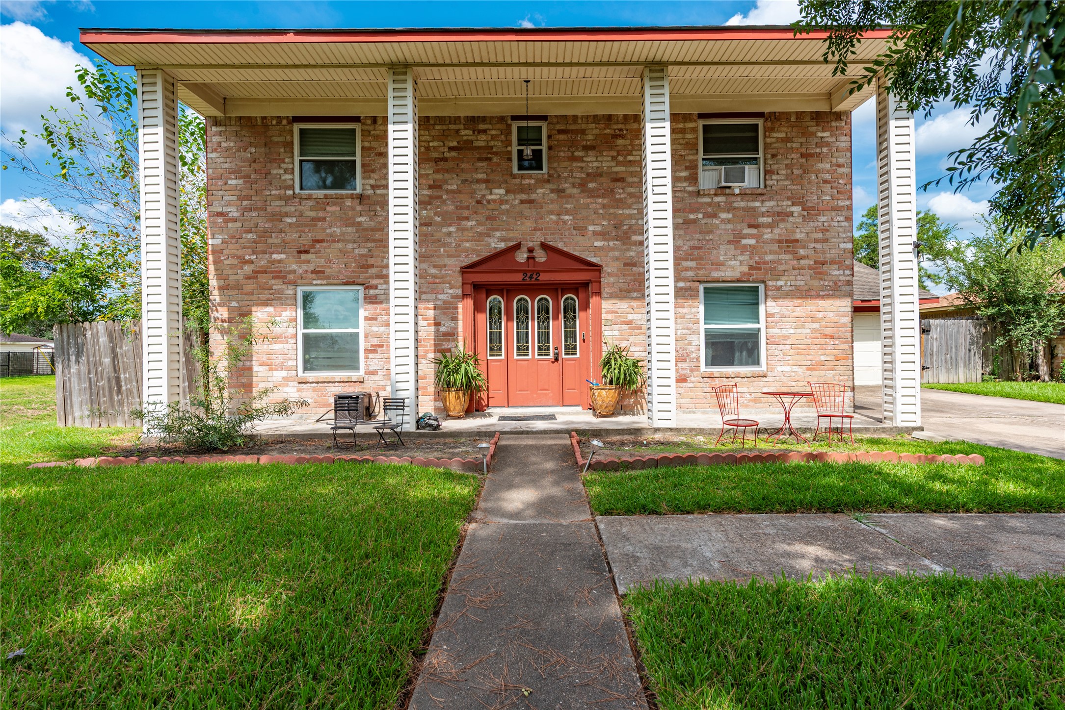 242 St Finans Way Houston, TX 77015 - Photo 1 of 25 a front view of a house with yard and green space