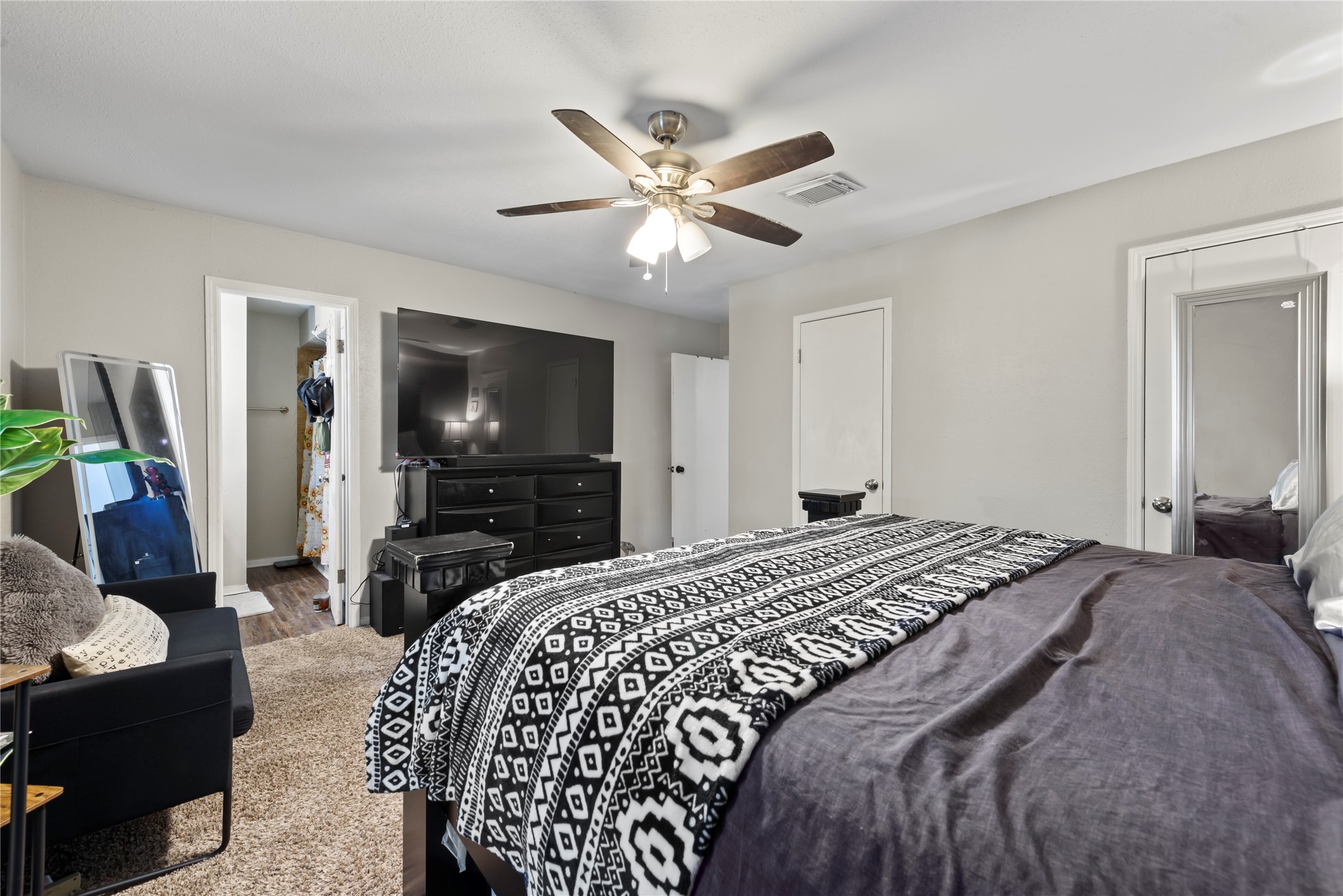 242 St Finans Way Houston, TX 77015 - Photo 18 of 25 a bedroom with a bed and a flat screen tv