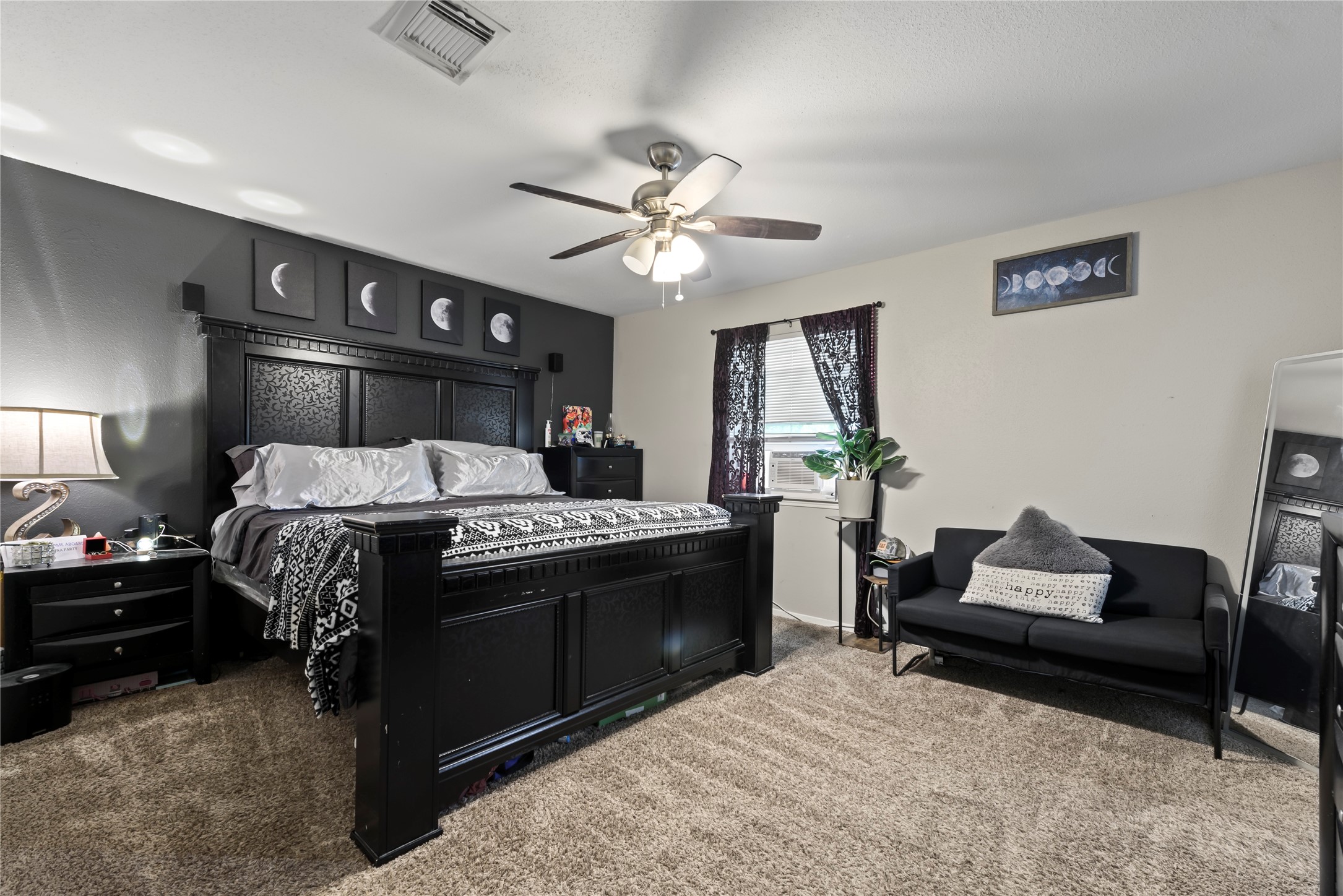 242 St Finans Way Houston, TX 77015 - Photo 19 of 25 a bed room with a bed and a chandelier