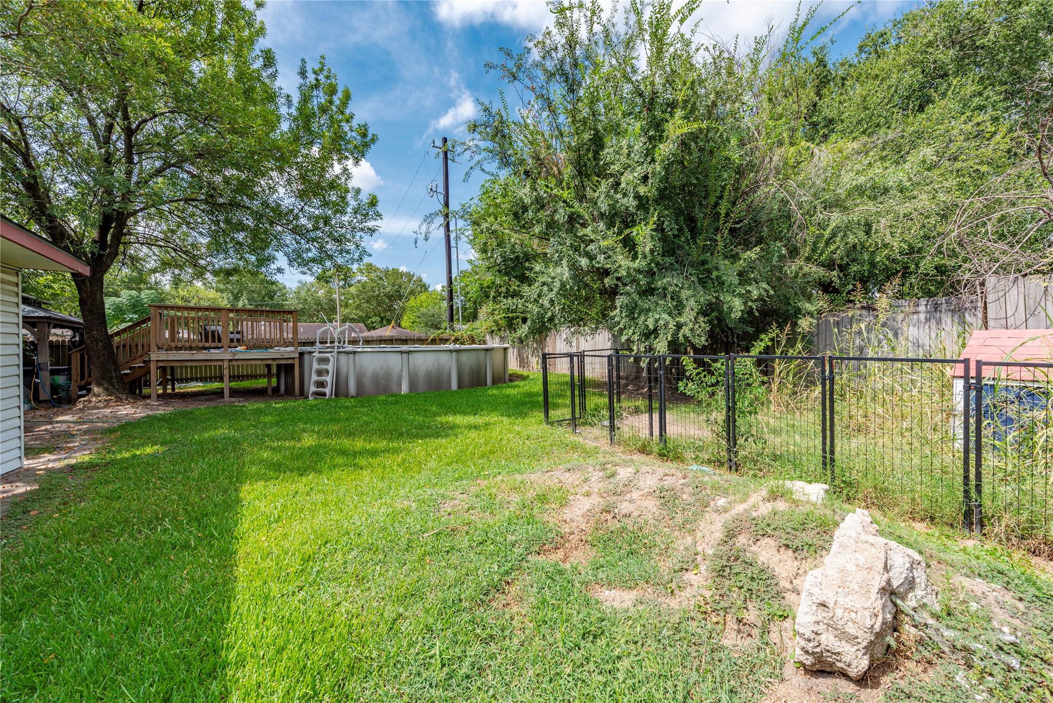 242 St Finans Way Houston, TX 77015 - Photo 23 of 25 a view of backyard with green space