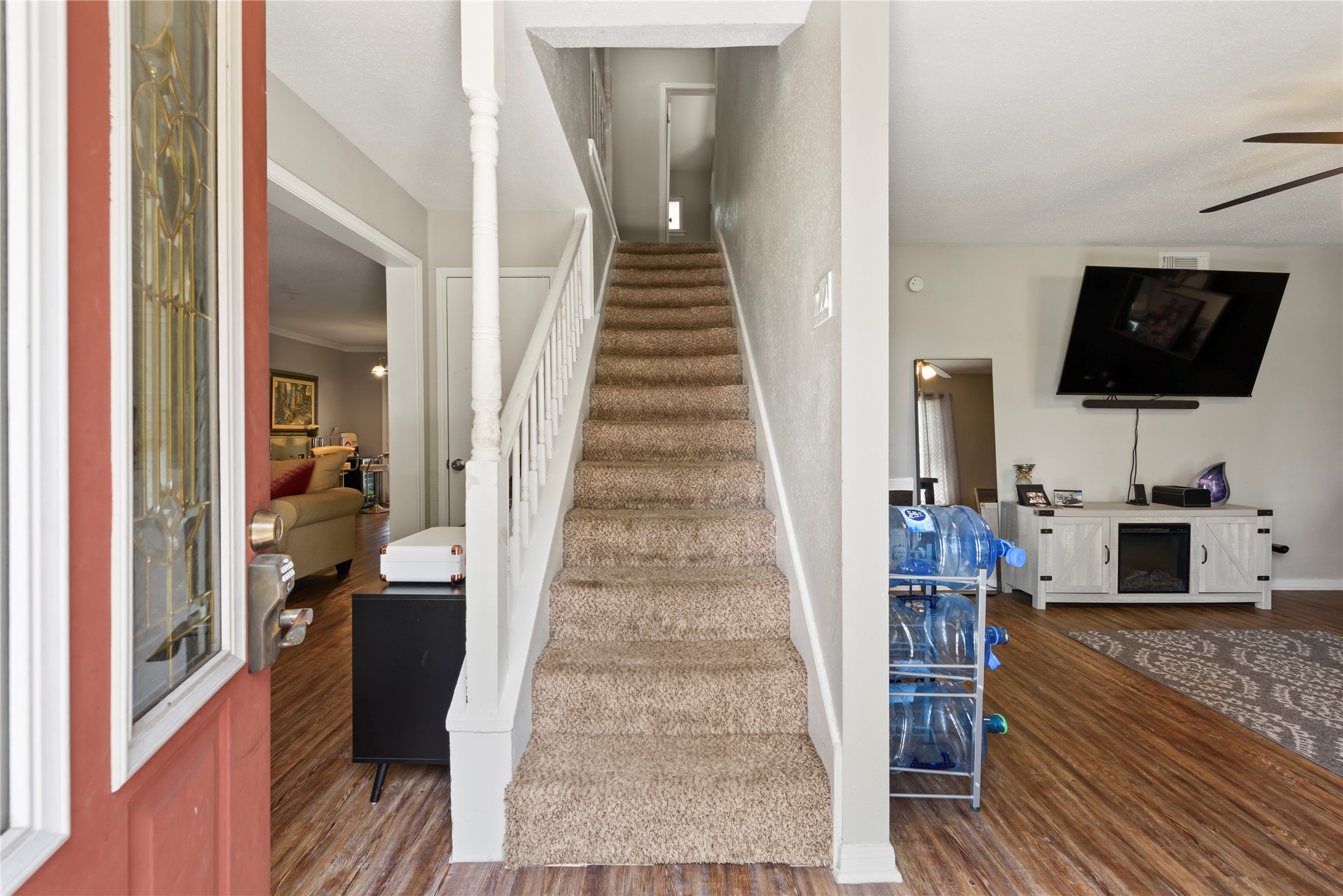 242 St Finans Way Houston, TX 77015 - Photo 4 of 25 a view of a living room with furniture and a flat screen tv