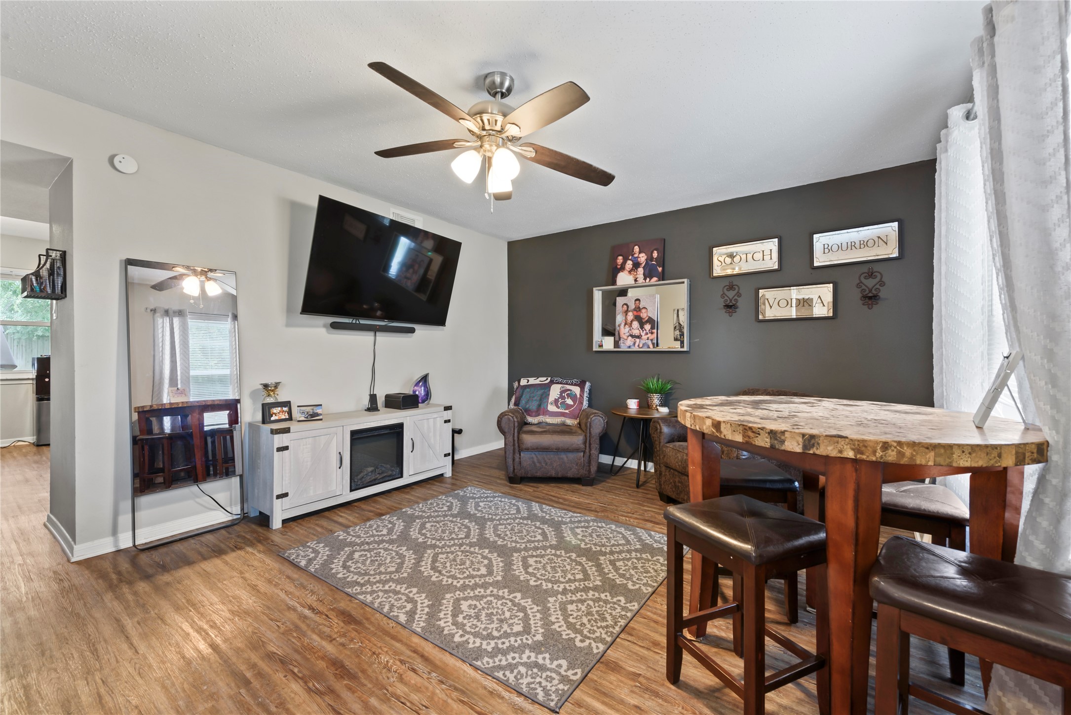 242 St Finans Way Houston, TX 77015 - Photo 8 of 25 a living room with furniture and a flat screen tv