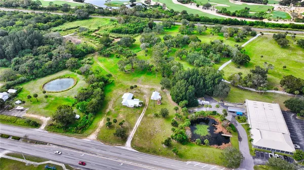 an aerial view of a house with a yard