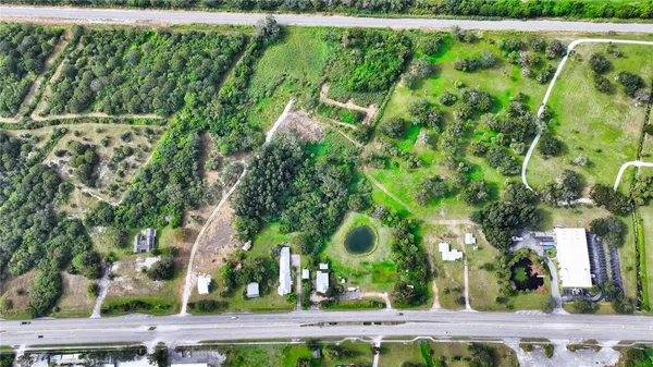 an aerial view of residential house with outdoor space and river
