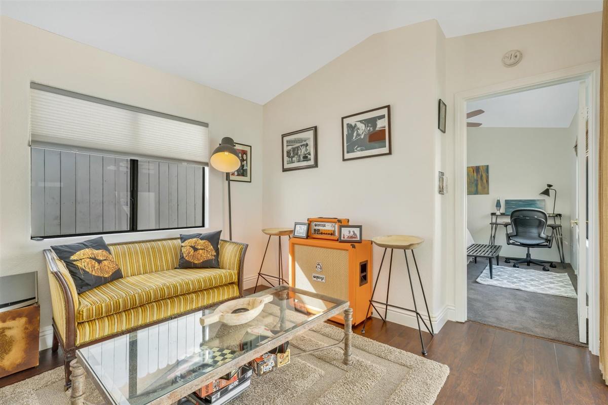 52695 Avenida Bermudas La Quinta, CA 92253 - Photo 33 of 49 a living room with furniture and a dining table with wooden floor
