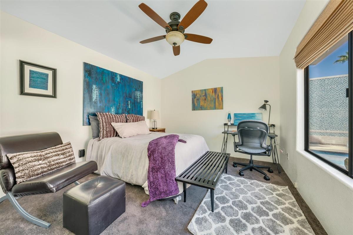 52695 Avenida Bermudas La Quinta, CA 92253 - Photo 35 of 49 a bedroom with a bed and wooden floor